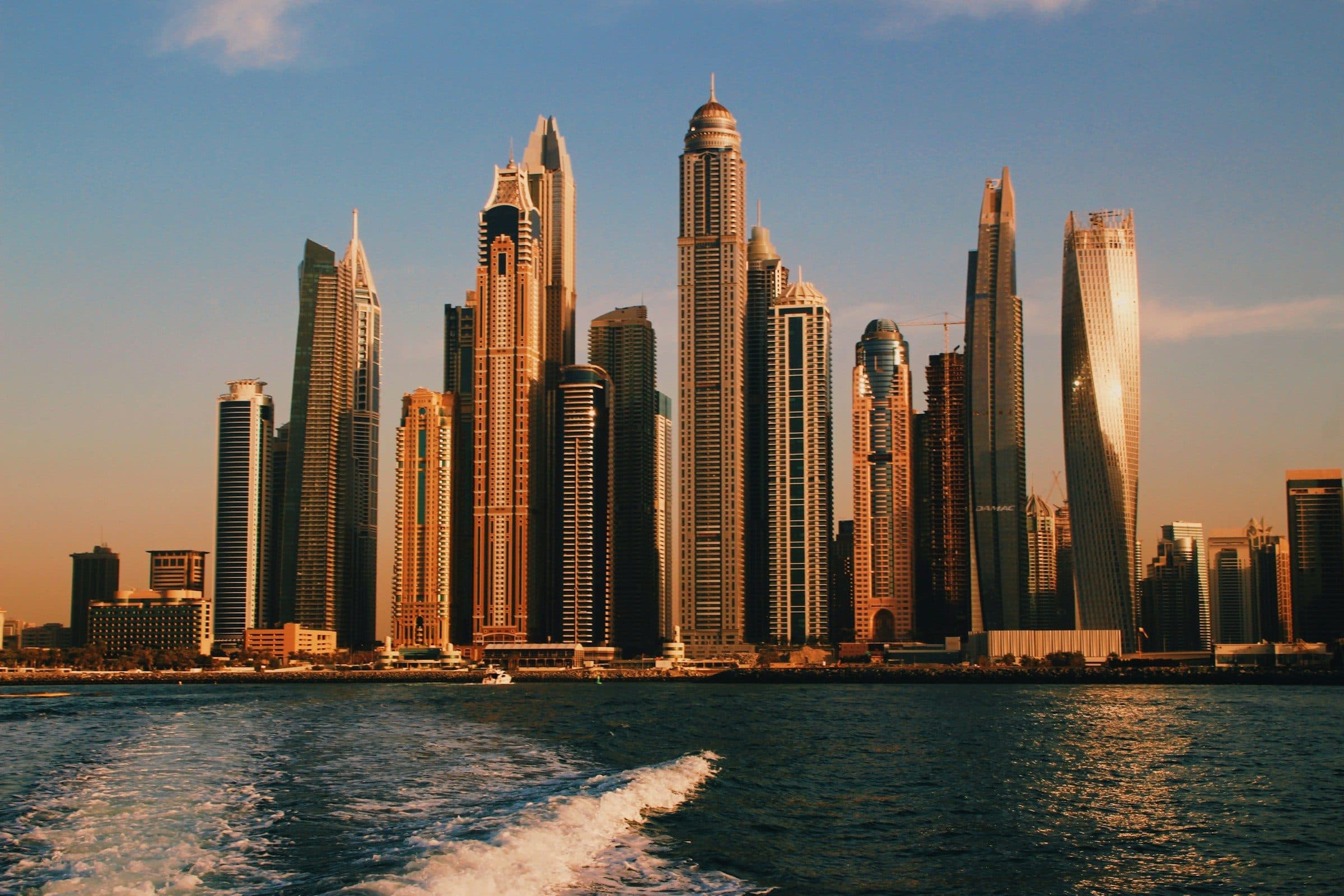Dubai Marina’s towers seen from the water in late-afternoon light